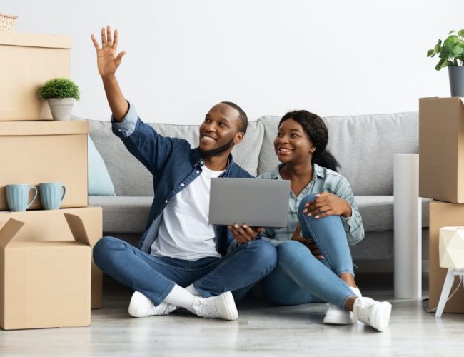 happy-black-couple-sitting-with-laptop-and-imagining-design-in-their-flat.jpg